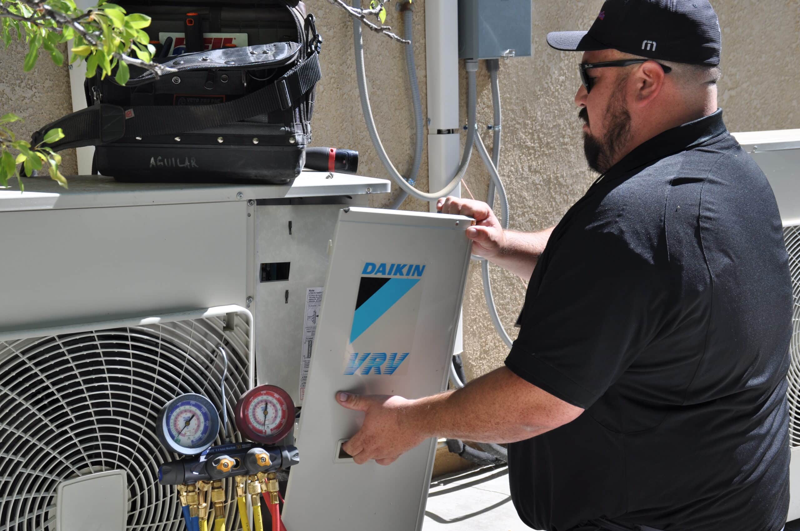 Employee installing Daikin unit