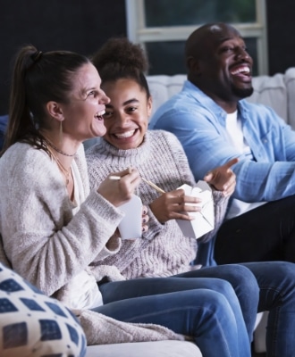 family enjoying a movie